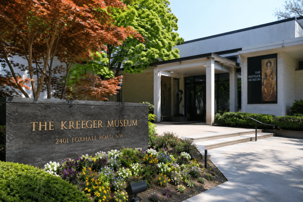 Entrance to The Kreeger Museum in Washington DC surrounded by gardens and trees.